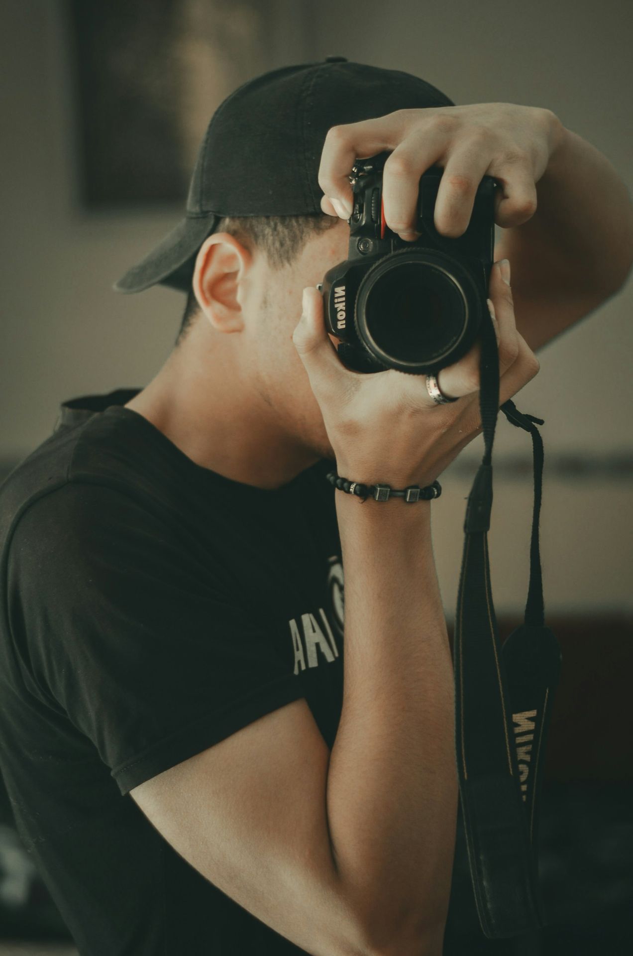 a man holding a camera up to his face